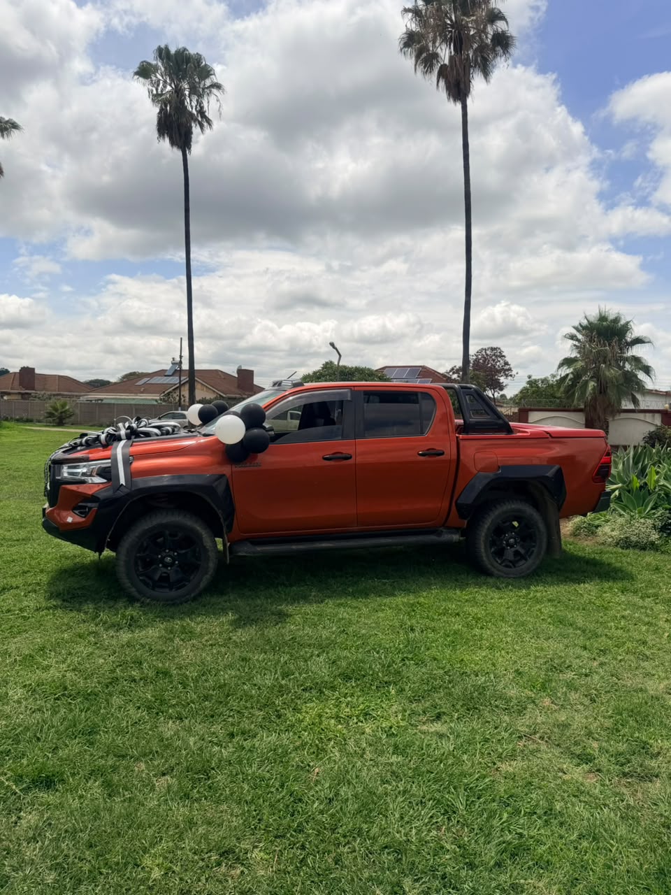 Orange Toyota Hilux GR Sport delivered by Lara Motors